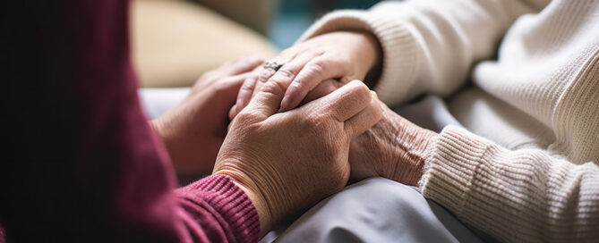 Hands holding each other for cancer support. Find a cancer support therapist in Raleigh, NC