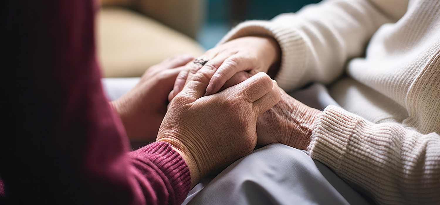 Hands holding each other for cancer support. Find a cancer support therapist in Raleigh, NC